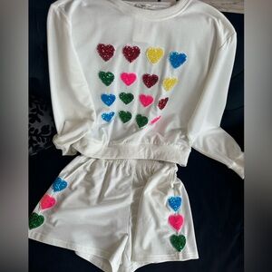♥️💙💚🩷 elastic waist shorts with pockets. Sequence hearts down both sides! NWT